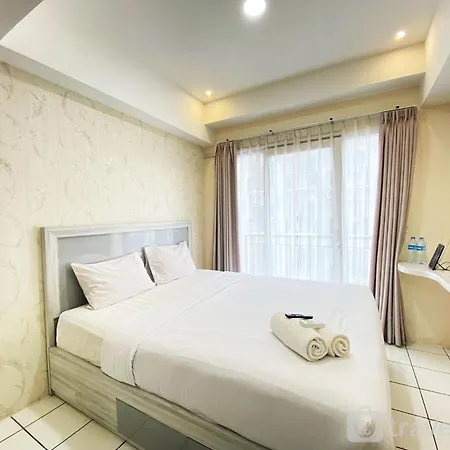 Comfy Studio Room At Grand Asia Afrika Apartment By Travelio
